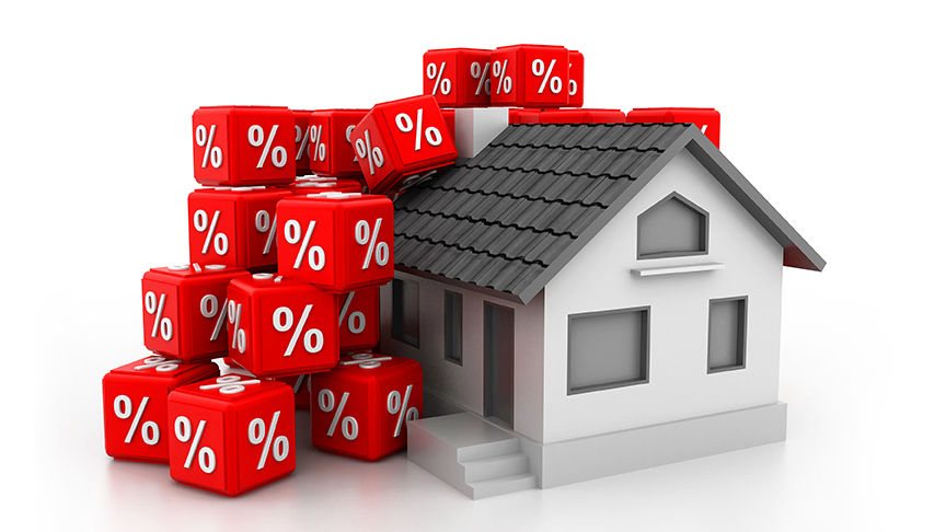 Red dice with percentage symbol and model house